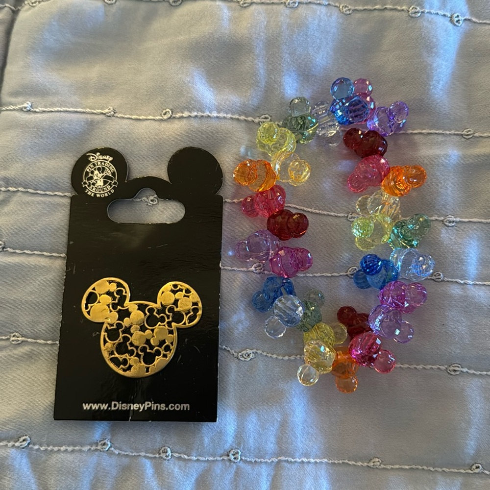 Disney pin and bracelet